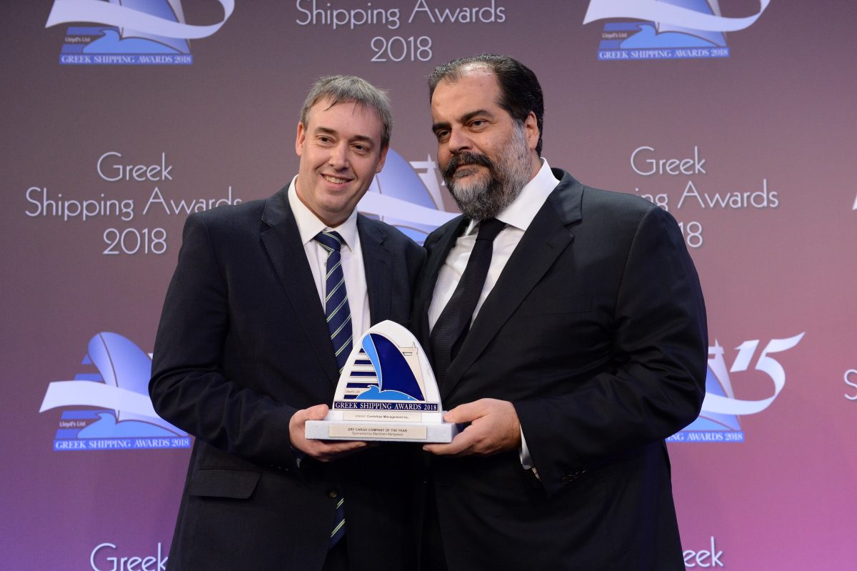 Nicolas D. Pateras (right) accepting the Dry Cargo Company of the Year Award for Contships Management Inc. from Matthew More of sponsor Marichem Marigases.