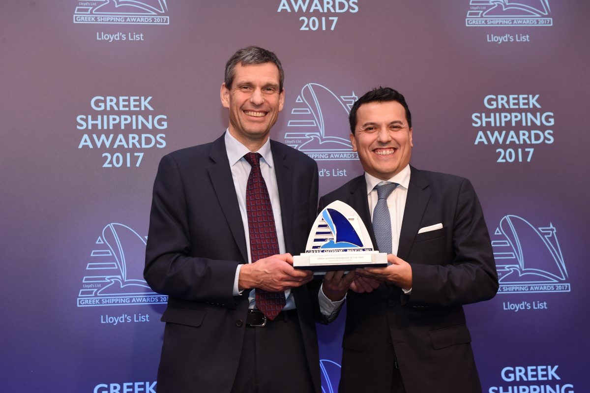 Ian White of sponsor ExxonMobil presenting the Greek Shipping Newsmaker of the Year Award to Carlos Pena, accepting on behalf of John Michael Radziwill.