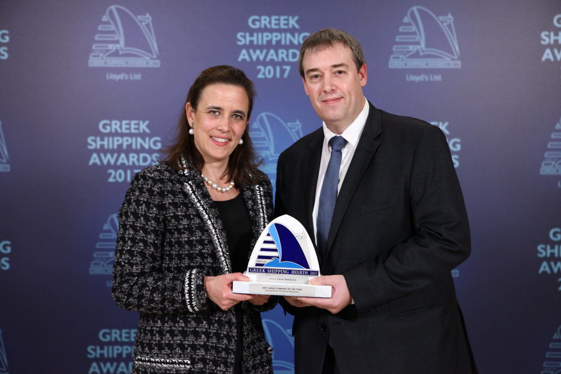 Tatiana Vourecas-Petalas accepting the Dry Cargo Company of the Year Award for Carras (Hellas) S.A. from Matthew More of sponsor Marichem Marigases.