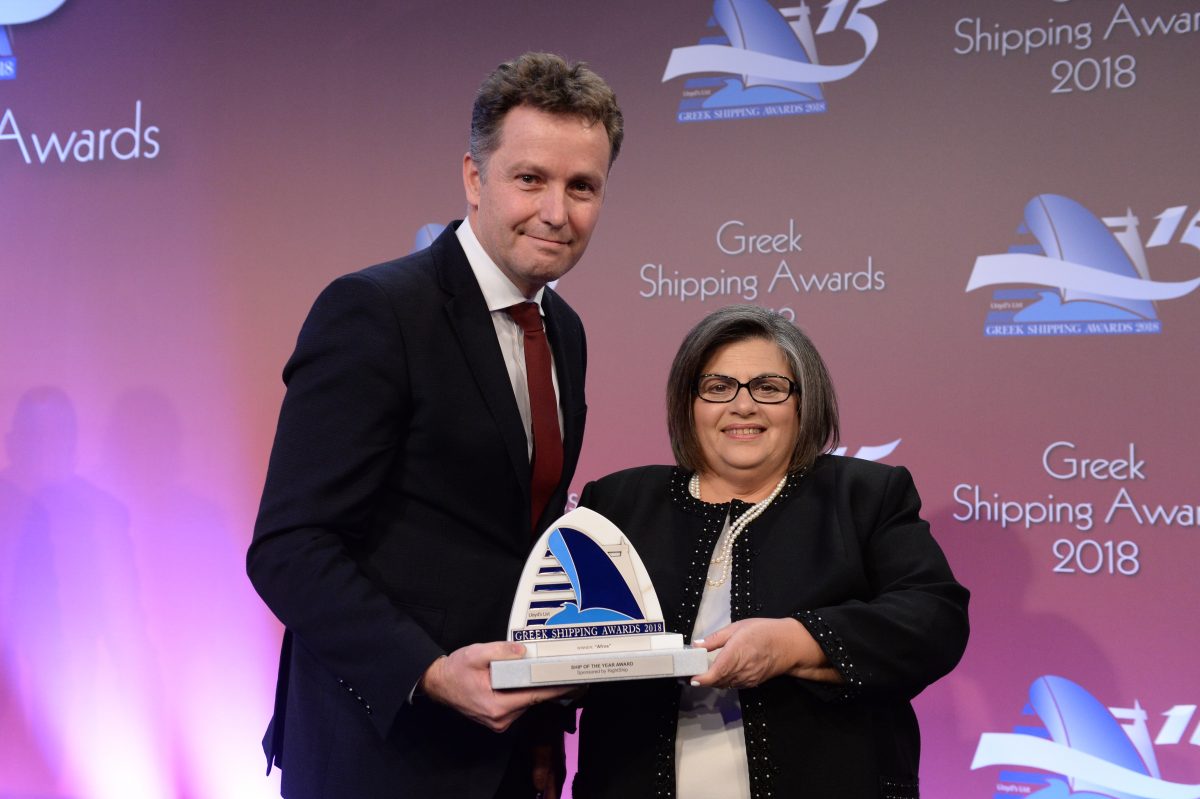 Martin Crawford-Brunt of sponsor RightShip presenting the Ship of the Year Award for m/v “Afros” to Marianthe Patrona of Blue Planet Shipping.